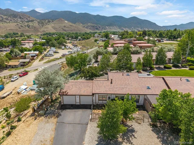 an aerial view of a house with a garden