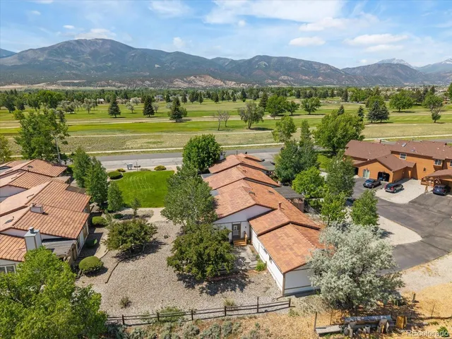 an aerial view of a town with couple of houses