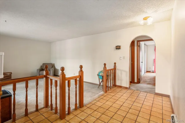 a view of a hallway with windows