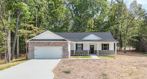 a house with trees in the background