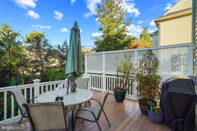 a view of a chair and table in the balcony