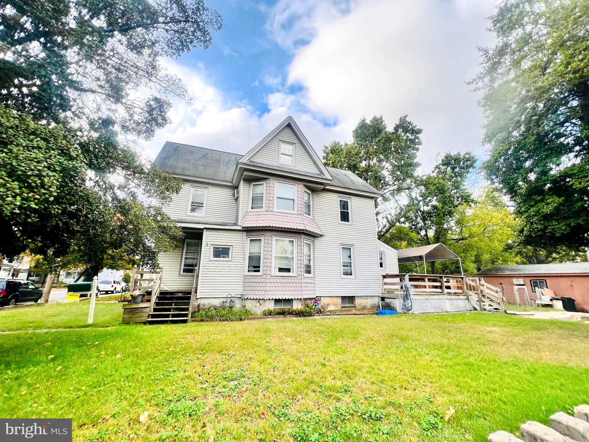 302 West Main Street Millville, NJ 08332 - Photo 2 of 22 a view of a house with a yard patio and swimming pool