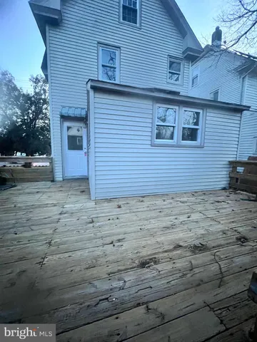 a view of a brick house with a yard