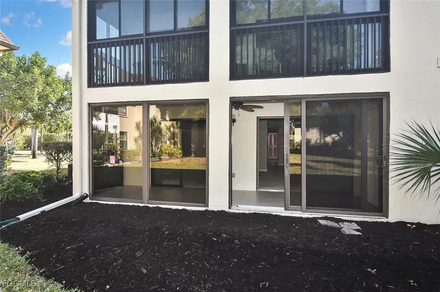 a view of swimming pool with outdoor seating and plants