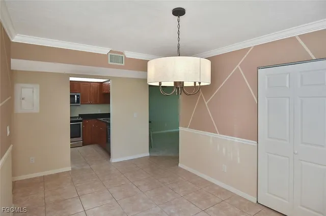 a view of an empty room with glass door
