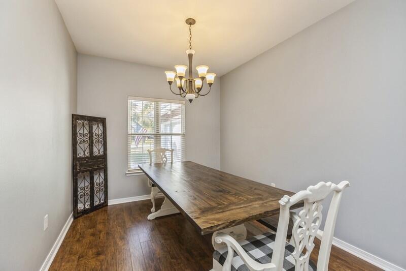 4599 Live Oak Church Road Crestview, FL 32539 - Photo 12 of 34 a view of a dining room with furniture and wooden floor