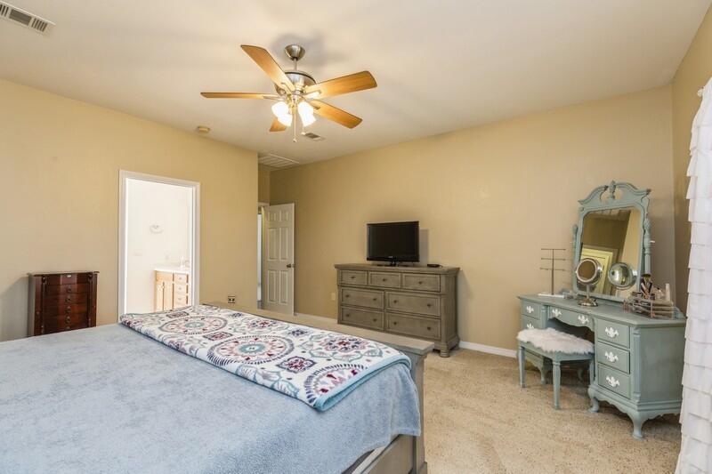 4599 Live Oak Church Road Crestview, FL 32539 - Photo 22 of 34 a bedroom with a bed and a flat screen tv