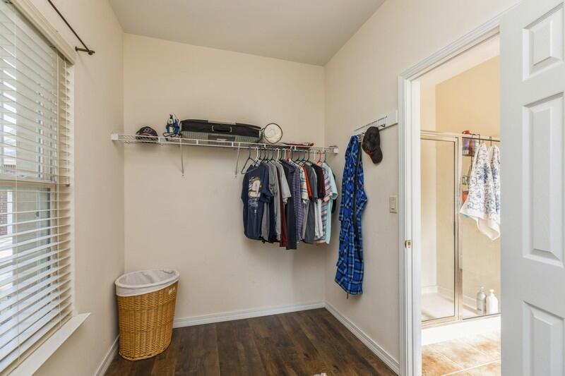 4599 Live Oak Church Road Crestview, FL 32539 - Photo 28 of 34 a view of walk in closet with clothes and shoes