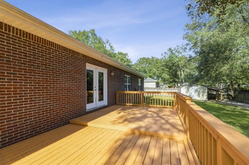 4599 Live Oak Church Road Crestview, FL 32539 - Photo 30 of 34 a view of backyard with a deck and wooden floor