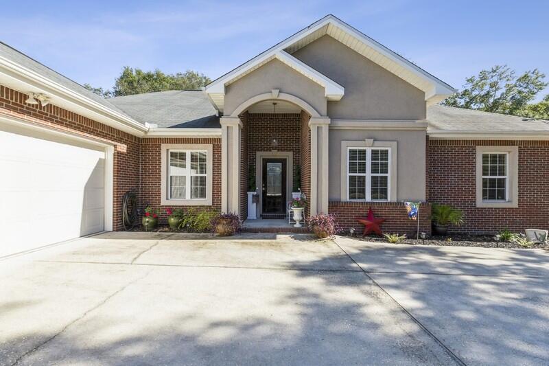 4599 Live Oak Church Road Crestview, FL 32539 - Photo 3 of 34 a front view of a house with a yard