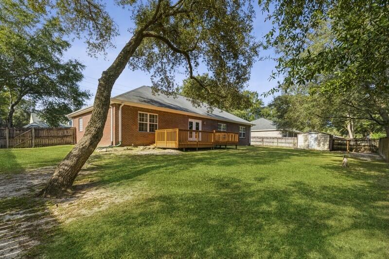 4599 Live Oak Church Road Crestview, FL 32539 - Photo 31 of 34 a view of a house with a backyard