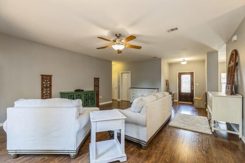 4599 Live Oak Church Road Crestview, FL 32539 - Photo 5 of 34 a living room with furniture and a chandelier