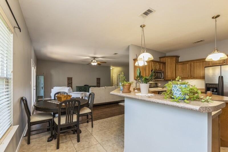 4599 Live Oak Church Road Crestview, FL 32539 - Photo 8 of 34 a view of a dining room and livingroom with furniture wooden floor a chandelier