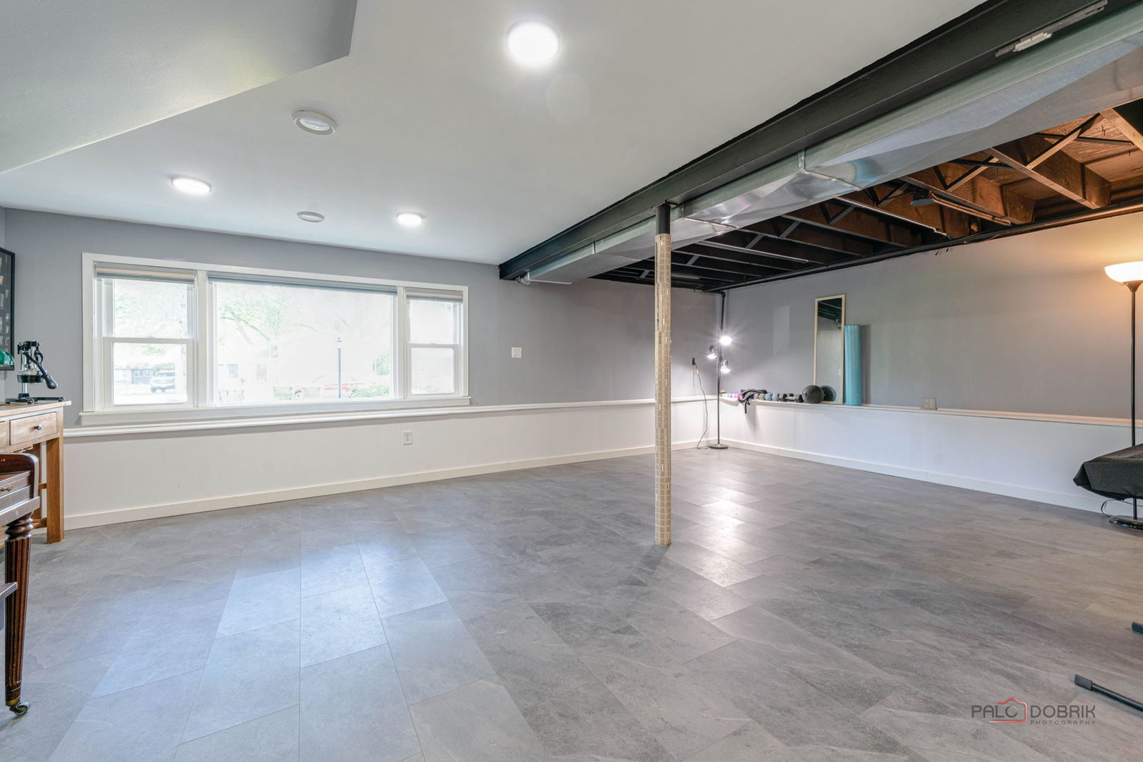489 1st Street Antioch, IL 60002 - Photo 18 of 33 an empty room with windows and pillars in it
