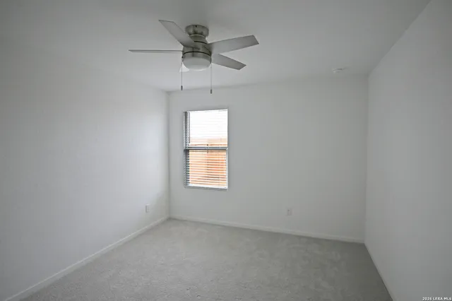 a view of a livingroom with a ceiling fan