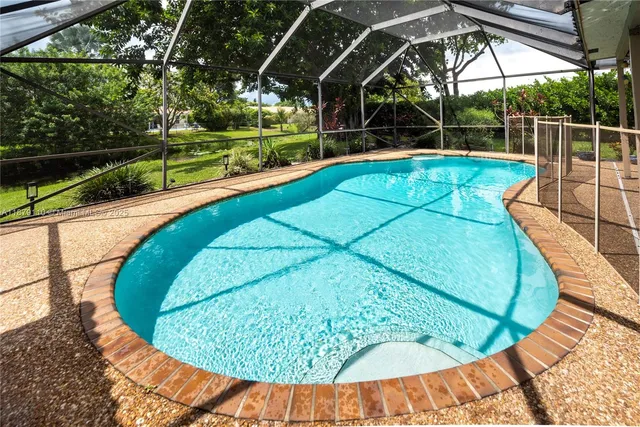 a view of a house with backyard and deck
