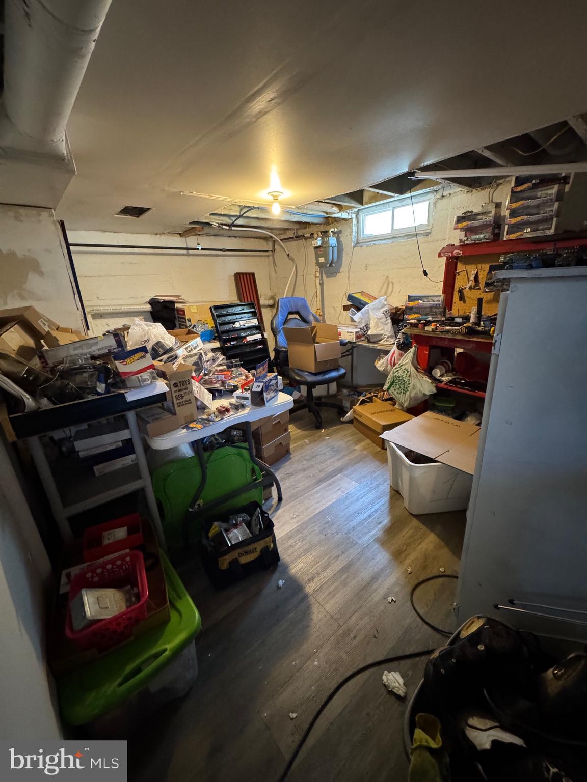 1515 Collings Road Camden, NJ 08104 - Photo 17 of 23 a room with lots of furniture and clutter