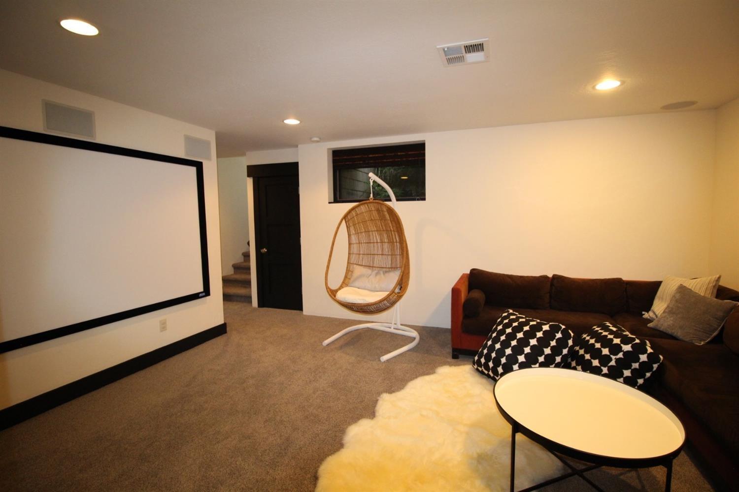 135 Lilly Road Jacksonville, OR 97530 - Photo 31 of 34 Media Room with a huge screen and fun se