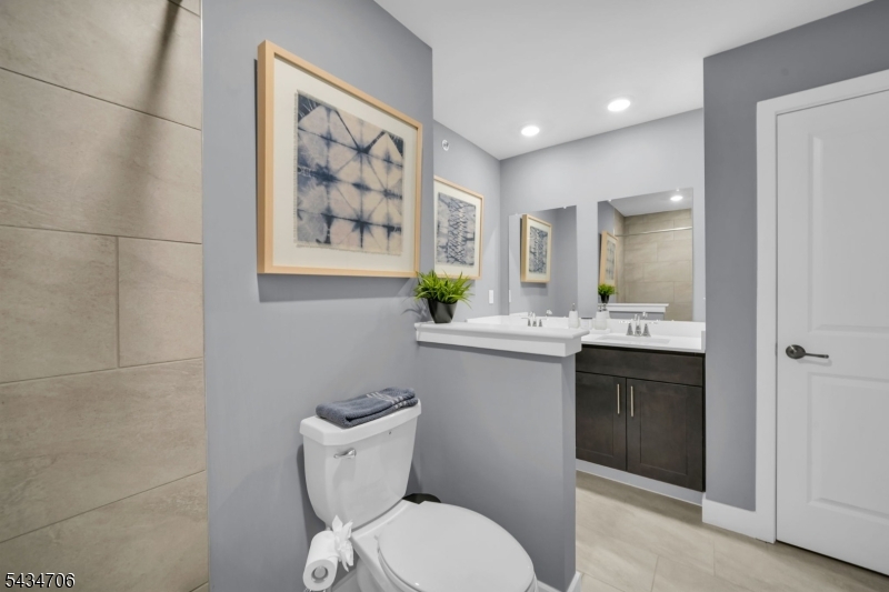 2 Doherty Way Morris Plains, NJ 07950 - Photo 19 of 33 a bathroom with a toilet a sink and mirror