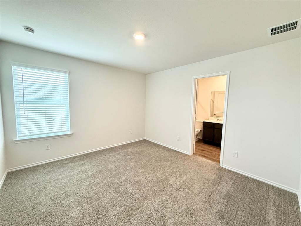 6114 Holly Spg Road Princeton, TX 75407 - Photo 4 of 7 an empty room with windows