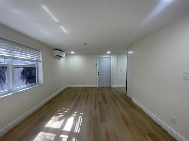 a view of an empty room with a window