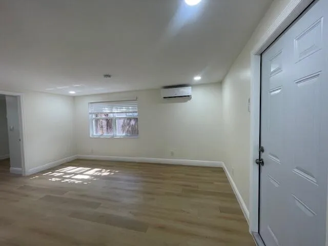 a kitchen with a refrigerator and a stove top oven