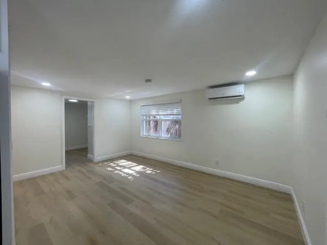 a view of an empty room with a window