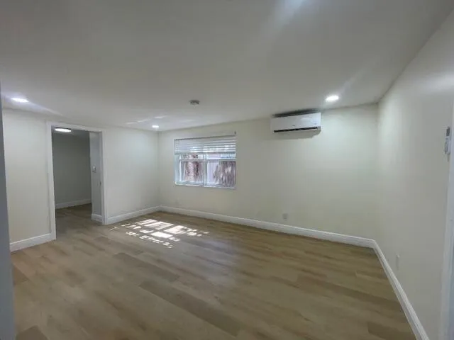 a bathroom with a toilet and a bathtub