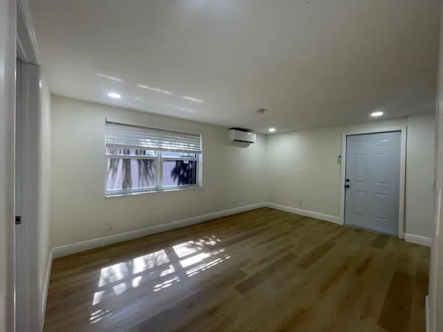 an empty room with a empty space and window