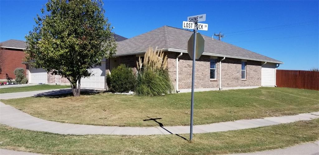 12227 Shine Avenue Rhome, TX 76078 - Photo 1 of 1 a front view of a house with a yard