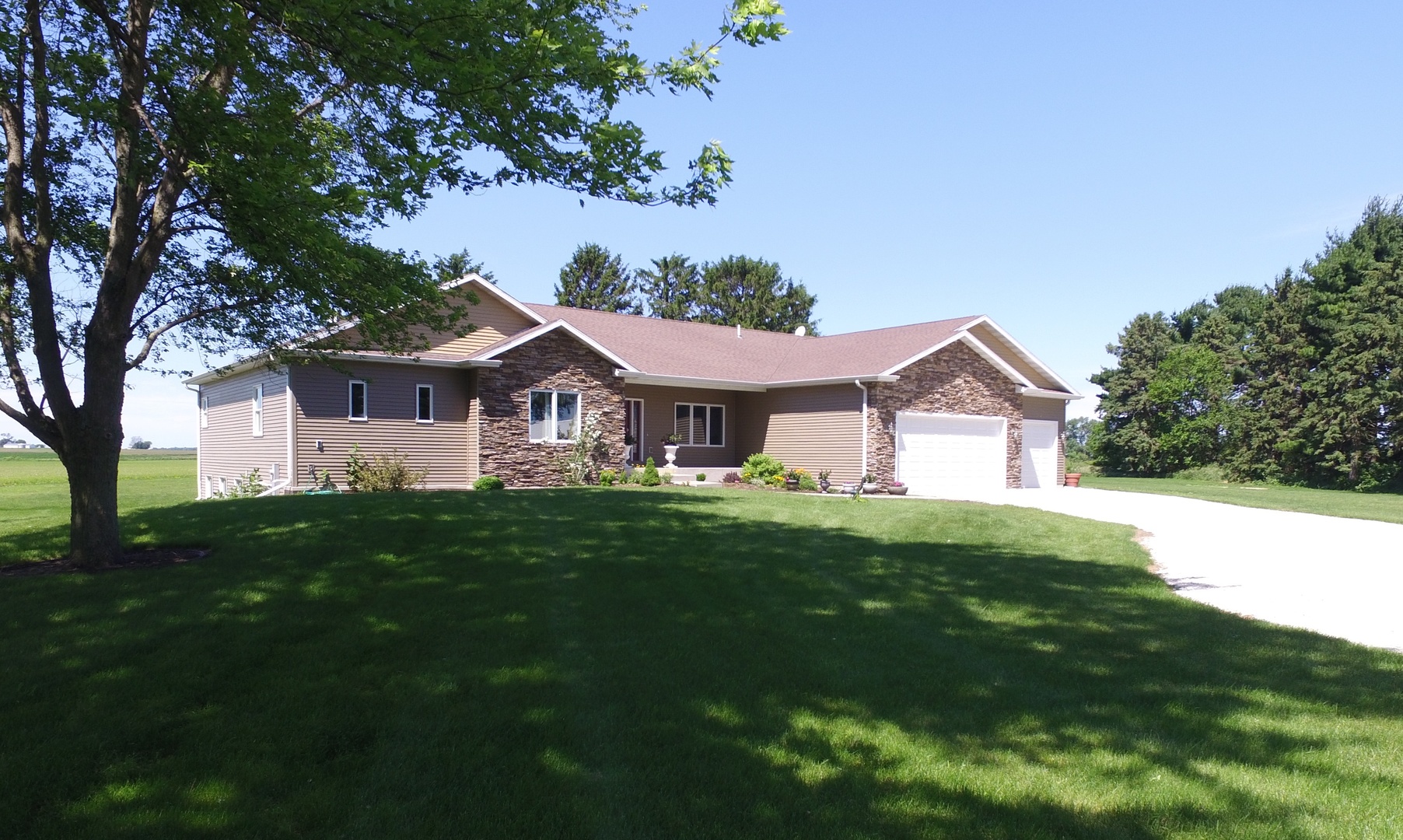 1246 Pinegar Road Garden Prairie, IL 61038 - Photo 1 of 43 a front view of a house with yard and green space