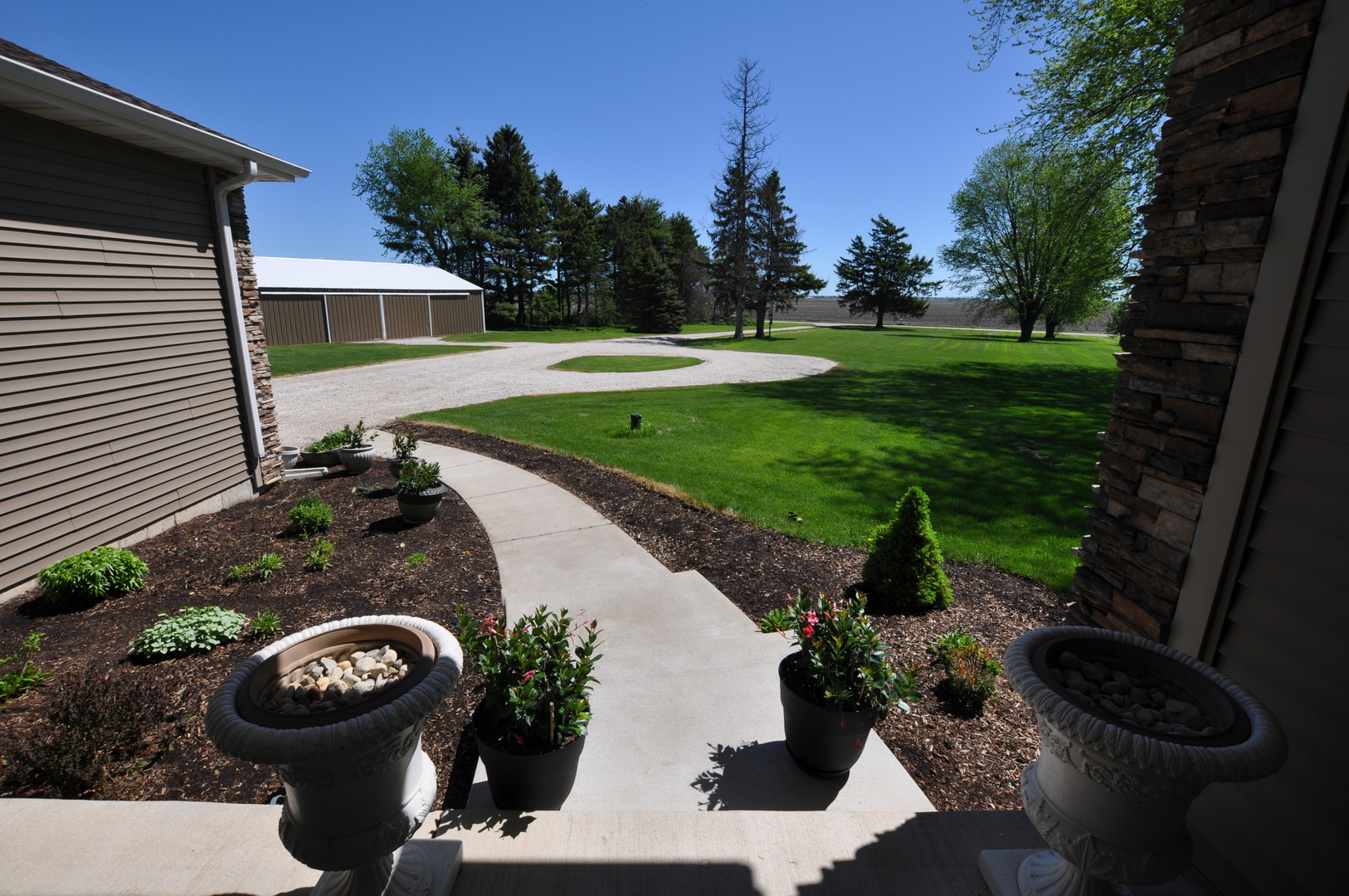 1246 Pinegar Road Garden Prairie, IL 61038 - Photo 2 of 43 a view of a backyard with sitting area and garden