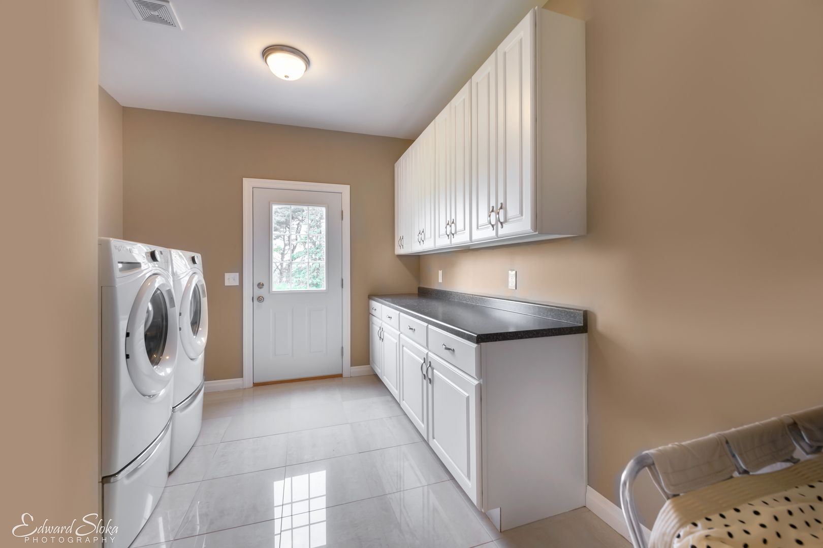 1246 Pinegar Road Garden Prairie, IL 61038 - Photo 14 of 43 a kitchen with a sink a washer and dryer