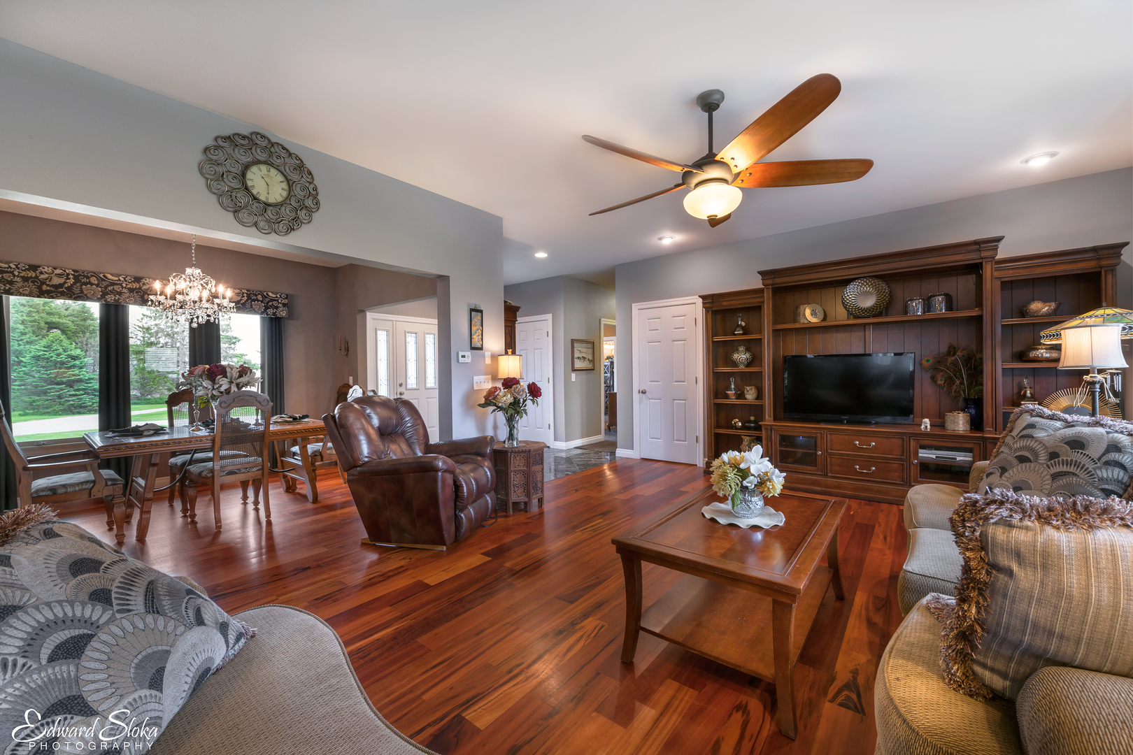 1246 Pinegar Road Garden Prairie, IL 61038 - Photo 19 of 43 a living room with furniture a flat screen tv and a table