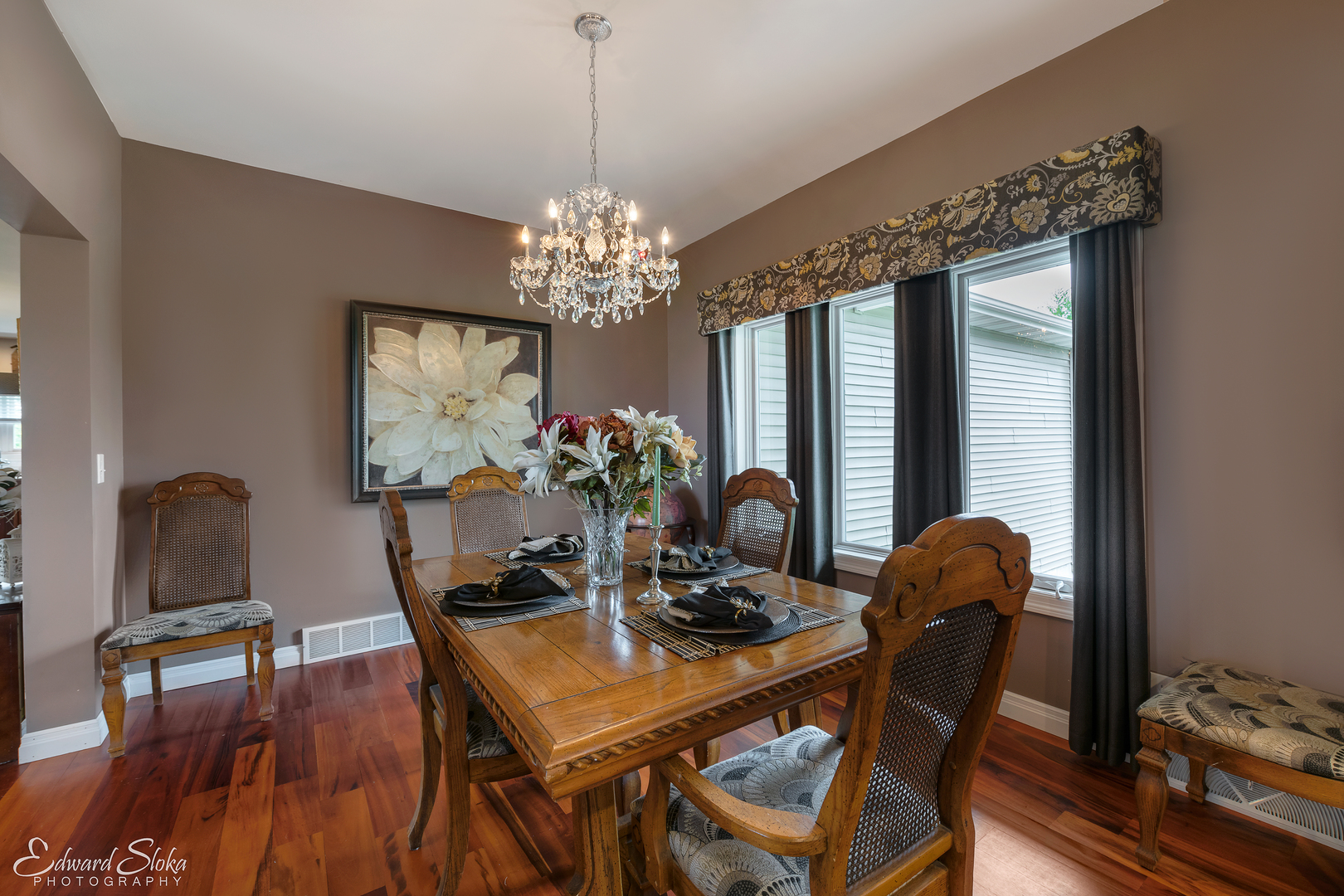1246 Pinegar Road Garden Prairie, IL 61038 - Photo 21 of 43 a dining room with furniture a chandelier and wooden floor