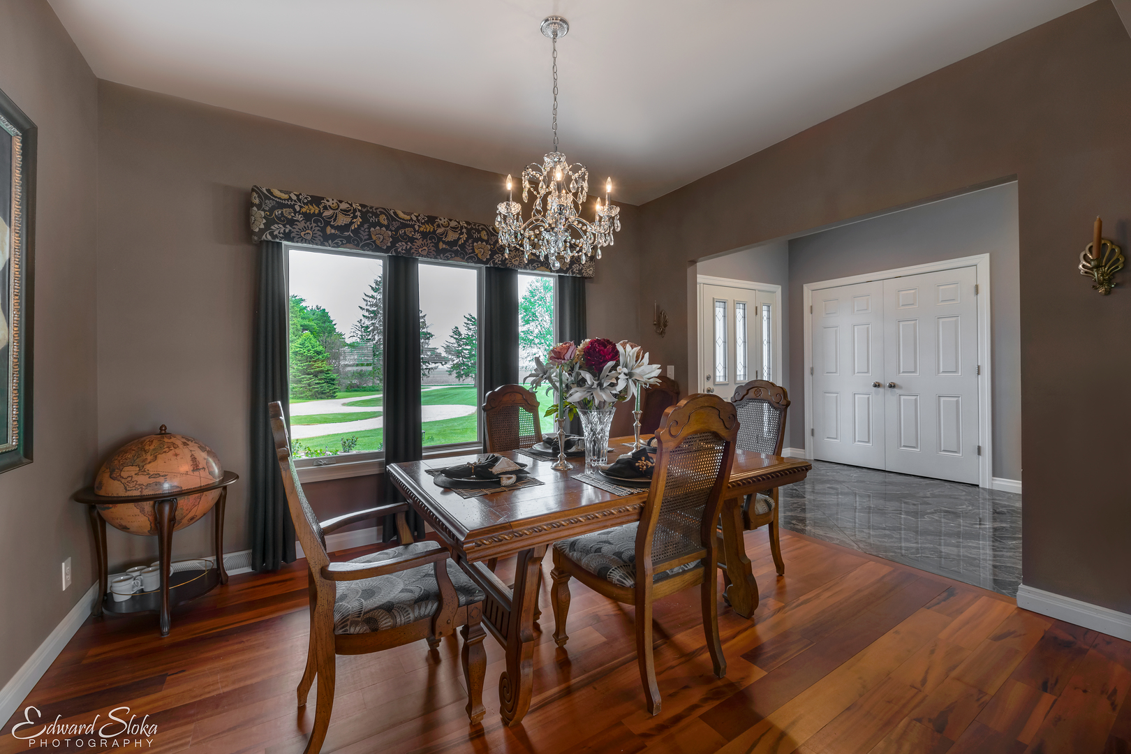 1246 Pinegar Road Garden Prairie, IL 61038 - Photo 22 of 43 a dining room with furniture a chandelier and wooden floor