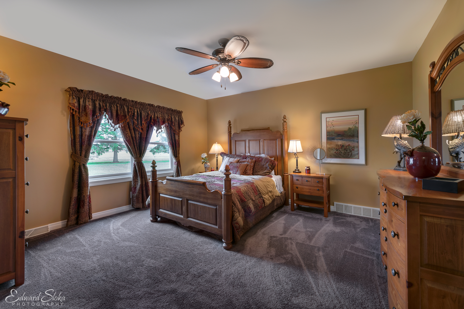 1246 Pinegar Road Garden Prairie, IL 61038 - Photo 23 of 43 a bedroom with a bed and a chandelier