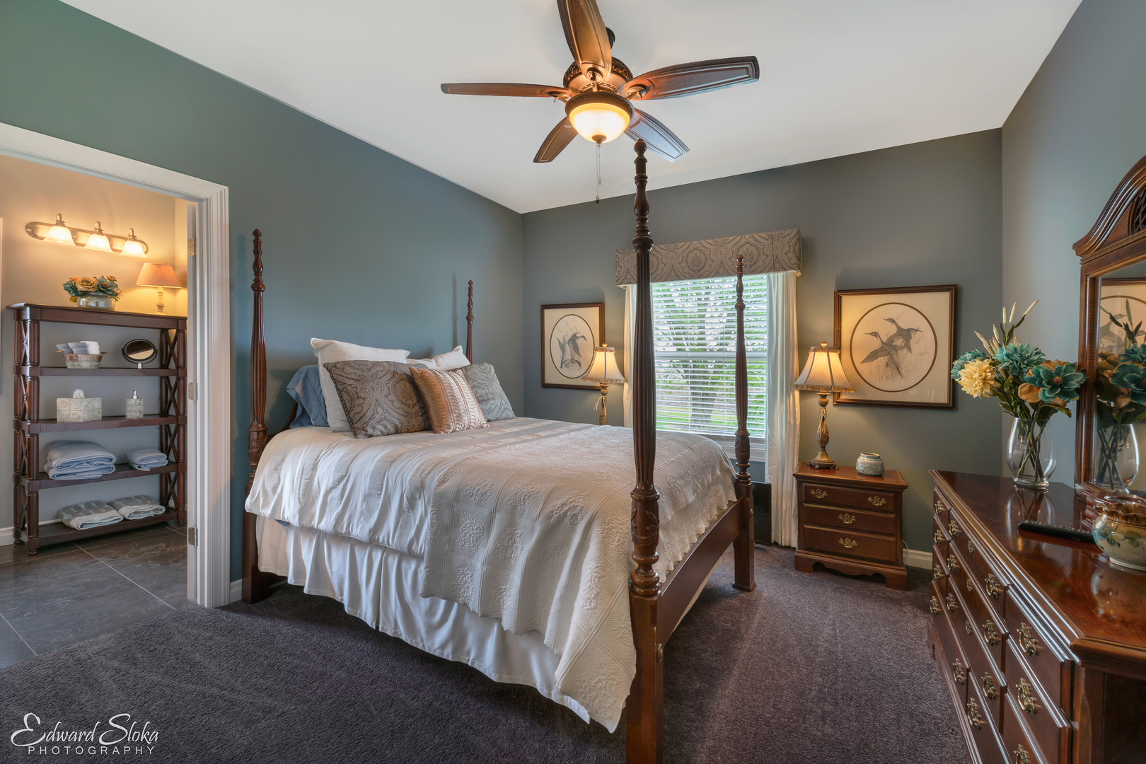 1246 Pinegar Road Garden Prairie, IL 61038 - Photo 27 of 43 a bedroom with a bed a dresser and with a chandelier
