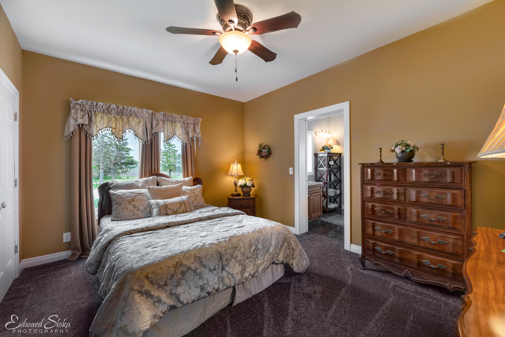 1246 Pinegar Road Garden Prairie, IL 61038 - Photo 29 of 43 a bedroom with a bed and a chandelier