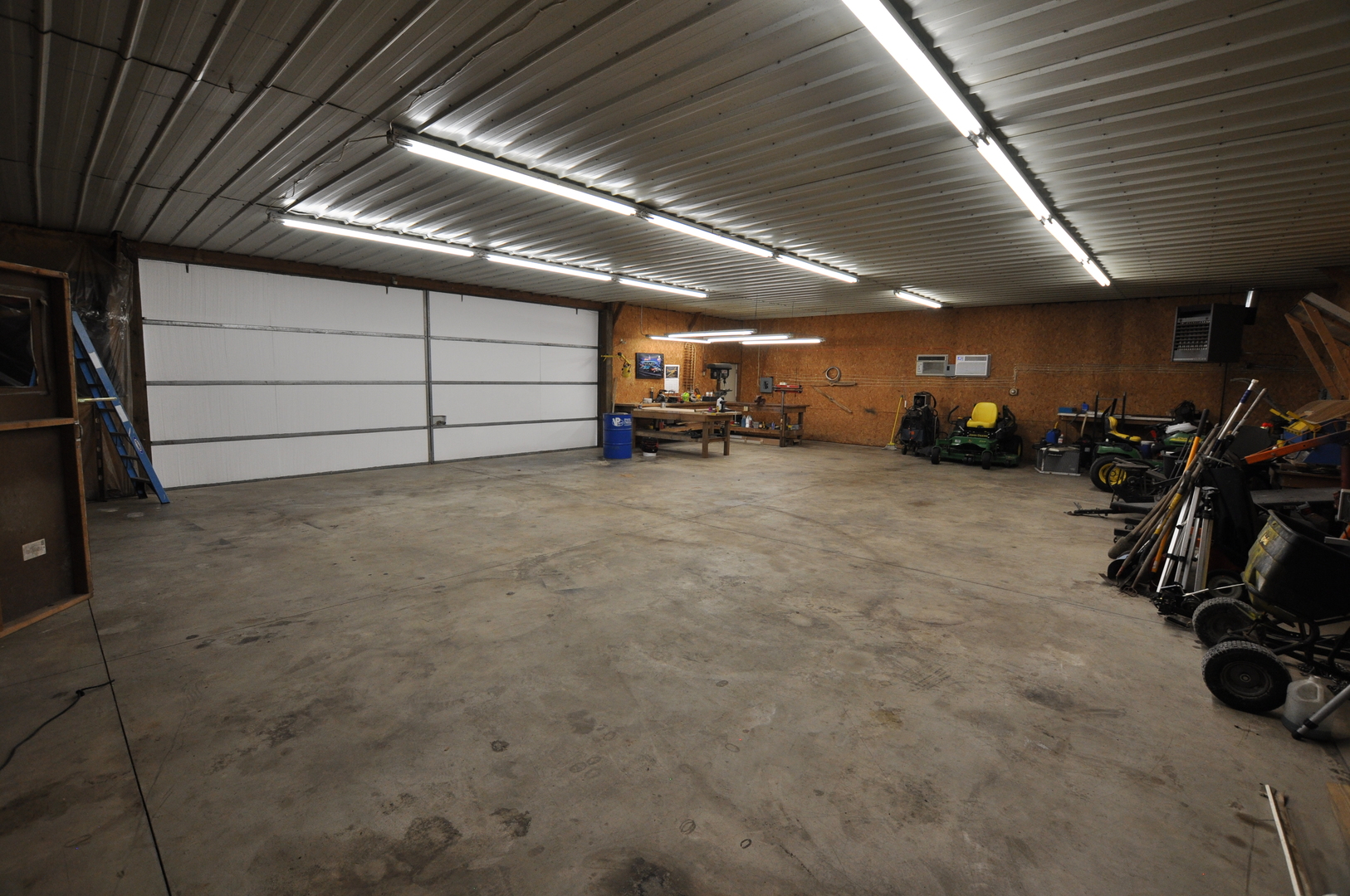 1246 Pinegar Road Garden Prairie, IL 61038 - Photo 41 of 43 a view of a garage with parked cars