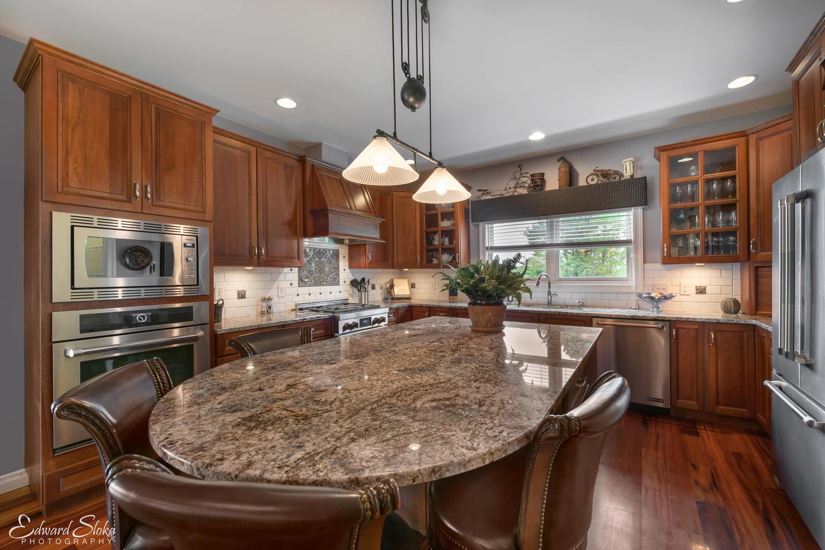 1246 Pinegar Road Garden Prairie, IL 61038 - Photo 7 of 43 a kitchen with stainless steel appliances granite countertop a stove refrigerator and a microwave