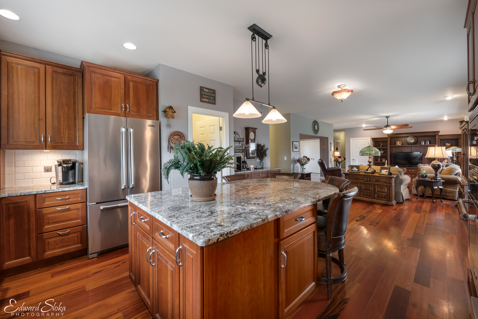 1246 Pinegar Road Garden Prairie, IL 61038 - Photo 9 of 43 a kitchen with stainless steel appliances granite countertop a refrigerator a sink dishwasher a stove and white cabinets with wooden floor