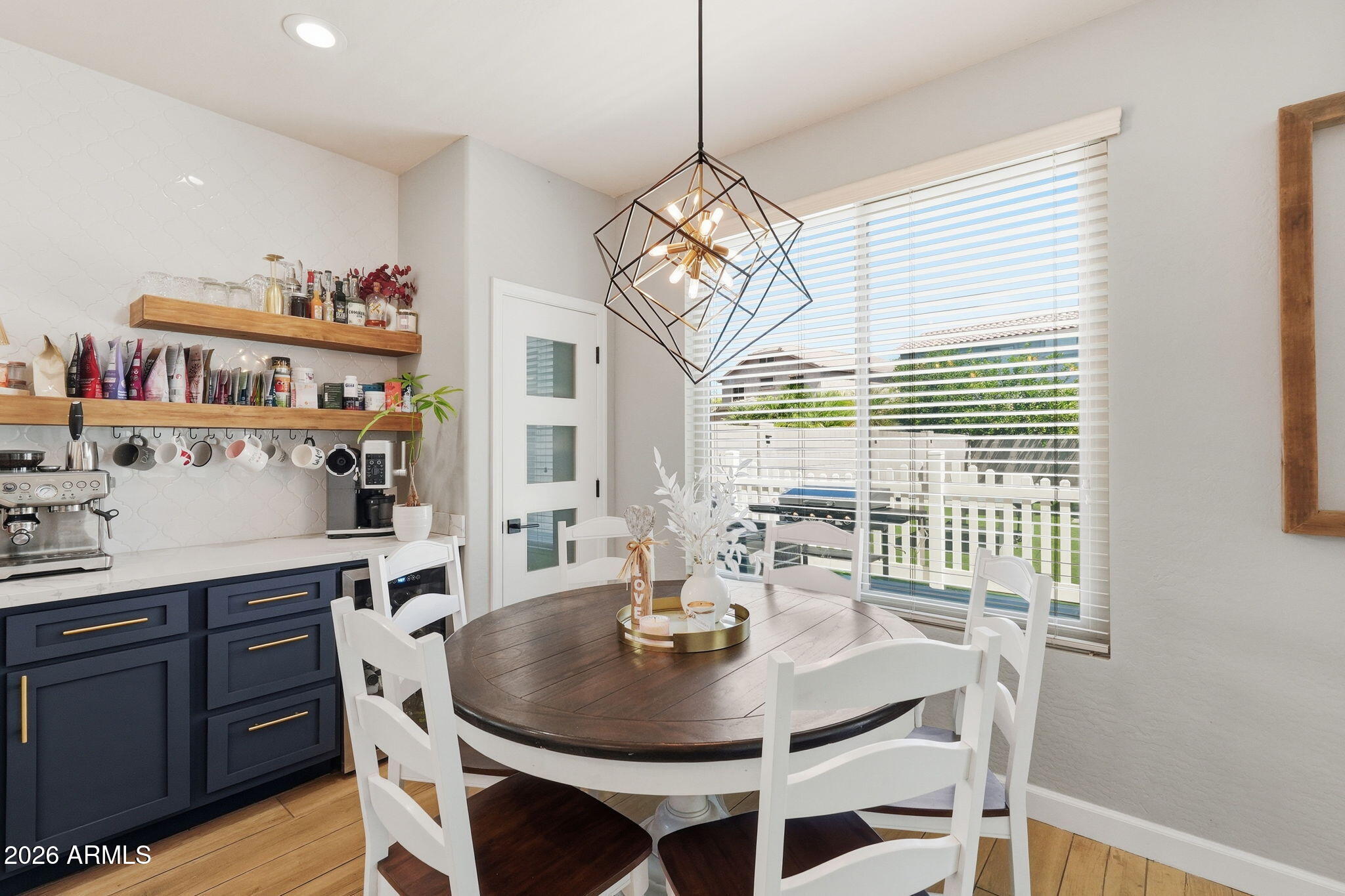 4184 East Trigger Way Gilbert, AZ 85297 - Photo 16 of 51 a dining room with furniture a chandelier and window