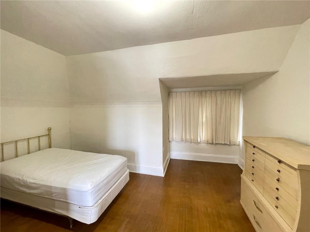 2209 Hawthorne Avenue Pittsburgh, PA 15218 - Photo 15 of 21 a bedroom with a bed and window