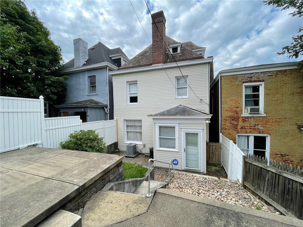 2209 Hawthorne Avenue Pittsburgh, PA 15218 - Photo 18 of 21 front view of a house with a yard