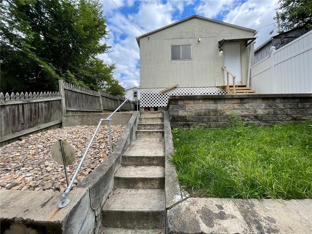2209 Hawthorne Avenue Pittsburgh, PA 15218 - Photo 19 of 21 a front view of a house with a yard