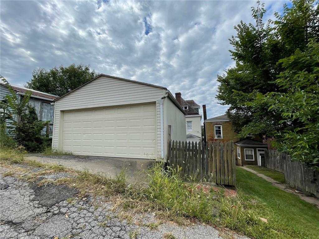 2209 Hawthorne Avenue Pittsburgh, PA 15218 - Photo 20 of 21 a backyard of a house with plants and large tree