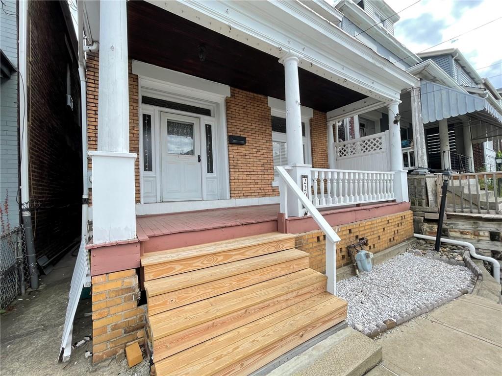 2209 Hawthorne Avenue Pittsburgh, PA 15218 - Photo 2 of 21 a view of backyard with deck and a garden