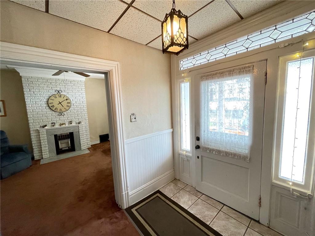 2209 Hawthorne Avenue Pittsburgh, PA 15218 - Photo 4 of 21 a view of a hallway with wooden floor and a kitchen