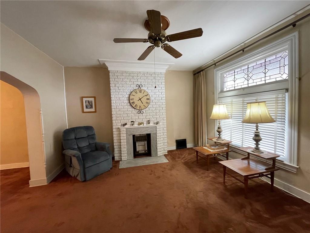 2209 Hawthorne Avenue Pittsburgh, PA 15218 - Photo 5 of 21 a living room with furniture and a fireplace